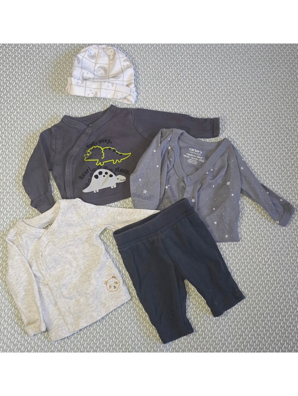 Mixed lot of newborn shirts, pants and hats. 5 pieces